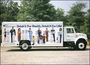 Studio Model Photography and Graphic Design for Side of Truck for Keystone Water by Dynamic Digital Advertising