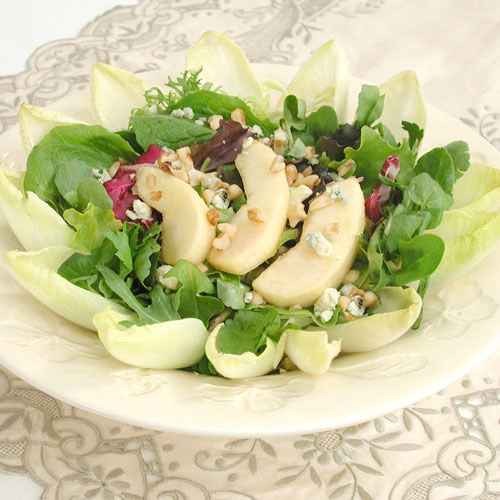 commercial photography of apples and roquefort with mixed greens - food photography